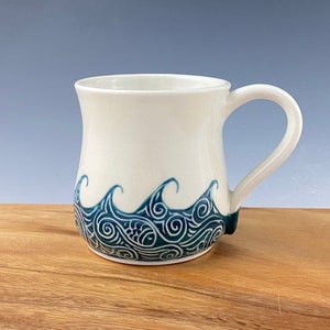 Pottery mug / Porcelain coffee cup, hand thrown and hand painted in wave pattern