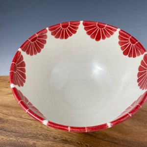 Pottery serving bowl with red flower design image 2