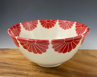 Pottery serving bowl with red flower design