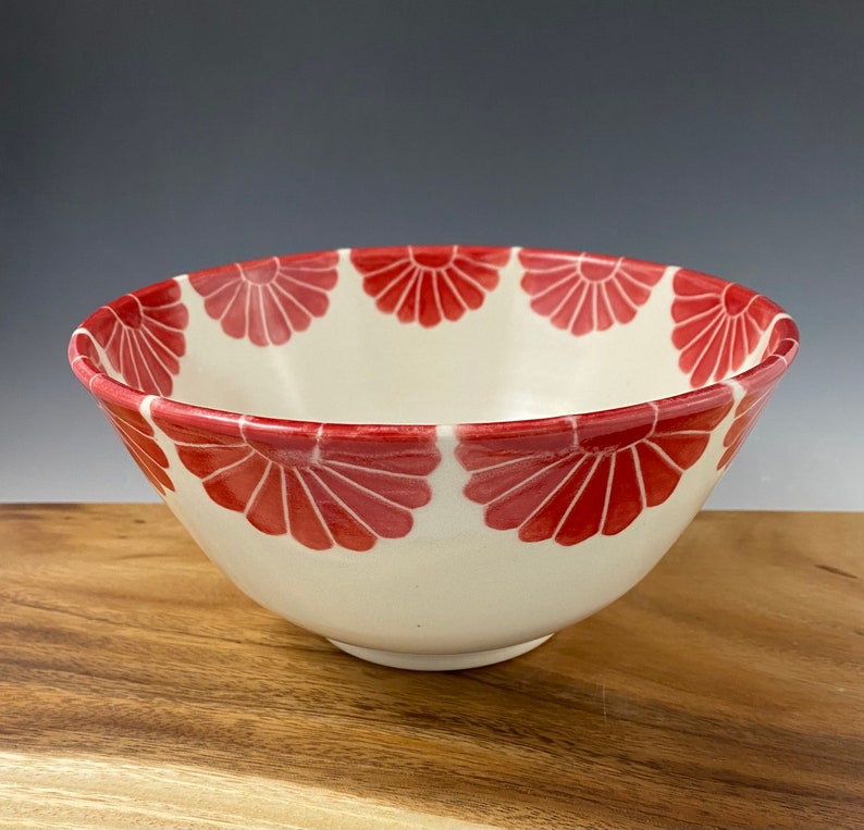Pottery serving bowl with red flower design image 1