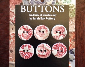 Red and white porcelain buttons, set of 6