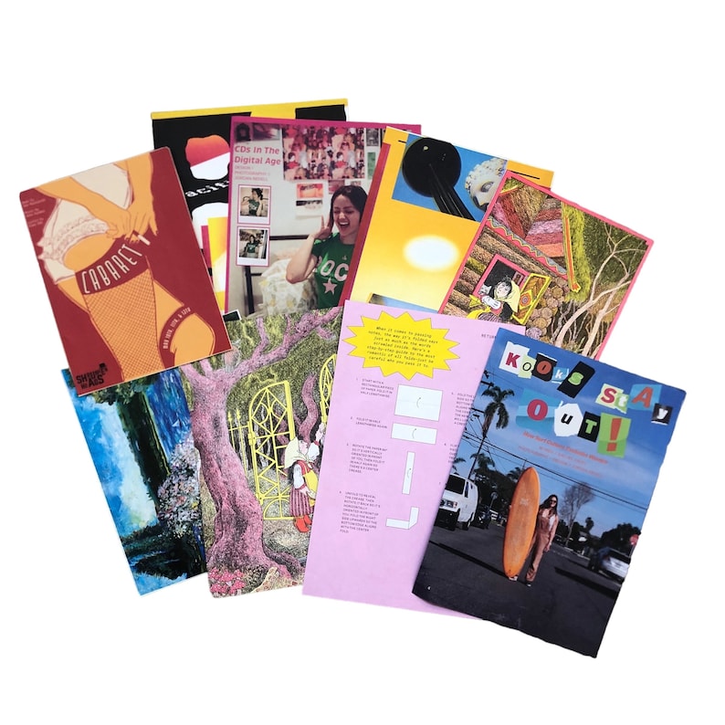 May include: A collection of various magazines and printed materials. The covers feature diverse illustrations and text, including the word "Cabaret" and the phrase "Kook Stay Out!". The color palette includes red, pink, blue, and yellow.