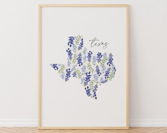 May include: A white print with a bluebonnet floral design in the shape of the state of Texas. The word "Texas" is written in black script above the state outline.