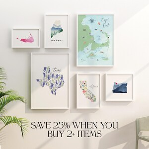 May include: A set of eight watercolor prints featuring different states and regions of the United States. The prints are framed in white and arranged on a white wall. The prints include Texas, Maine, Cape Cod, California, and Oregon. The text "Save 25% when you buy 2+ items" is displayed below the prints.