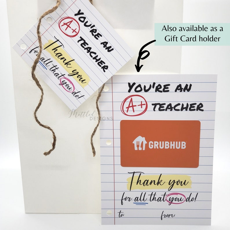 May include: A white card with a red circle and the text "You're an A+ Teacher" and a yellow rectangle with the text "Thank you for all that you do!"  The card has a space to write "to:" and "from:" at the bottom. A red and orange gift card for Grubhub is attached to the card.