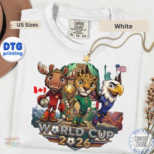 White World Cup 2026 graphic t-shirt featuring cartoon animal mascots representing USA Canada and Mexico soccer tournament fans.