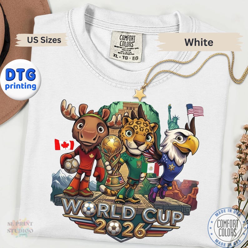 White World Cup 2026 graphic t-shirt featuring cartoon animal mascots representing USA Canada and Mexico soccer tournament fans.