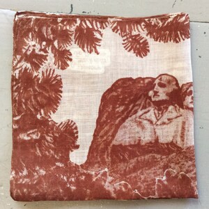 May include: Square, off-white handkerchief with a brown illustration. The illustration depicts a scene with figures, trees, and foliage. The edges of the handkerchief are hemmed with a brown stitch.