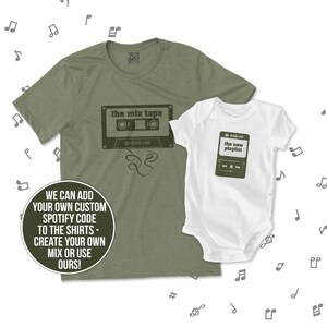 May include: A green t-shirt with a cassette tape graphic and the text "the mix tape". A white baby onesie with a music player graphic and the text "the new playlist".