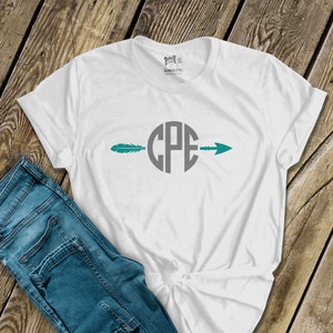 May include: White t-shirt with a teal feather and arrow design. The arrow goes through a circle with the letters "CPE" inside.