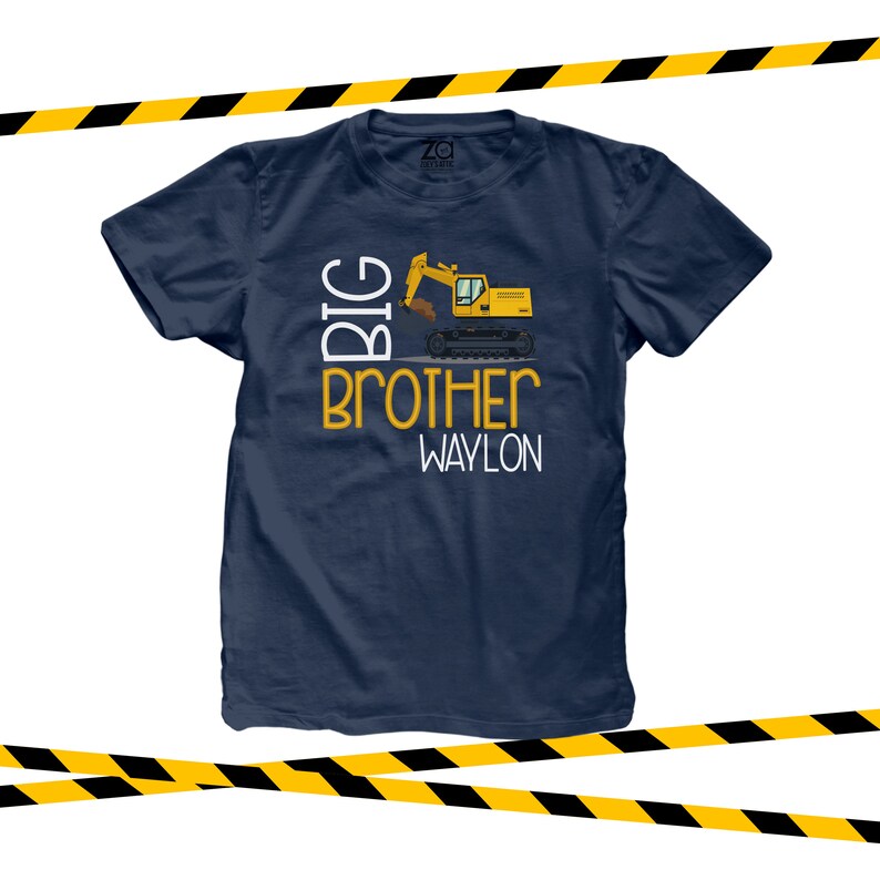 May include: Navy blue t-shirt with a yellow excavator graphic and the text "BIG BROTHER WAYLON".