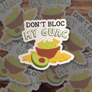 May include: A white sticker with the text "Don't Bloc My Guac" in black. The sticker features a bowl of guacamole with tortilla chips and a green avocado.