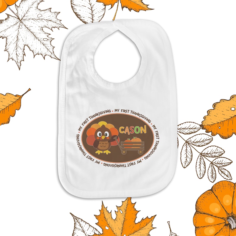May include: White baby bib with a brown circle design featuring a cartoon turkey with the text "My First Thanksgiving - Cason - My First Thanksgiving".