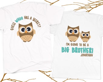 May include: Two white t-shirts with an owl design. The front shirt says "Guess who has a secret?" with a brown owl. The back shirt says "I'm going to be a big brother! Jonathan" with two brown owls.
