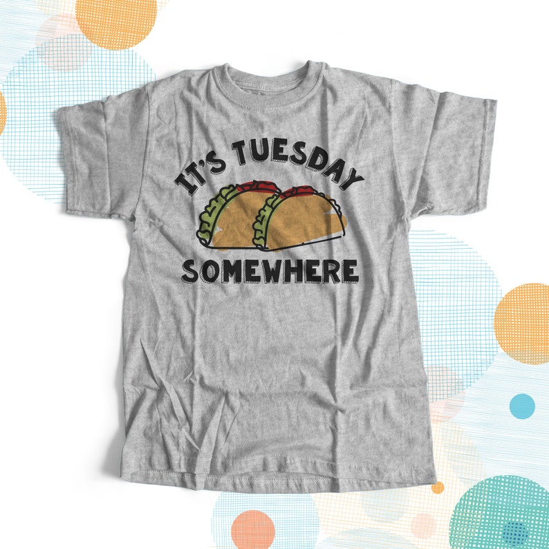 May include: Gray t-shirt with the text "It's Tuesday Somewhere" and a cartoon image of two tacos.