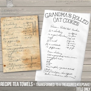 May include: A white tea towel featuring a printed recipe for Grandma's Rolled Oat Cookies, displayed next to an aged, stained paper original of the same handwritten recipe. The text includes ingredients like shortening, sugar, egg, milk, oats, and raisins.