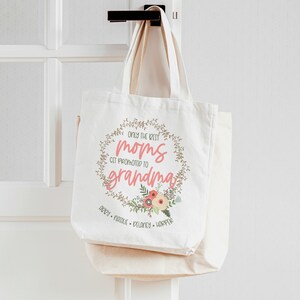 May include: White canvas tote bag with the text "Only the best moms get promoted to grandma" in a floral wreath. The names Abby, Natalie, Delaney, and Harper are listed below the wreath.