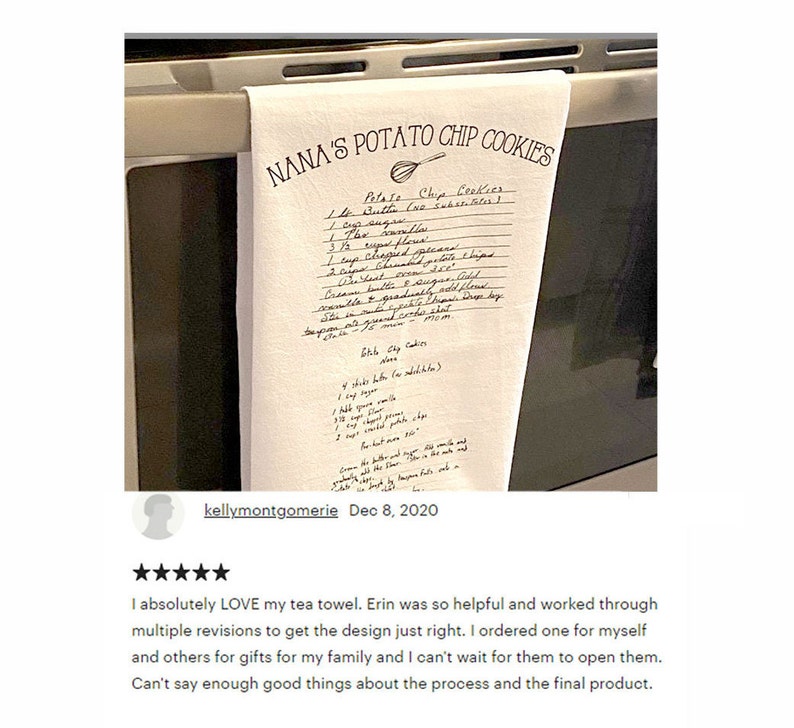May include: A white tea towel featuring a printed recipe titled Nana's Potato Chip Cookies. The design includes a whisk illustration and handwritten-style text detailing ingredients and baking instructions, hanging over a stainless steel oven handle.