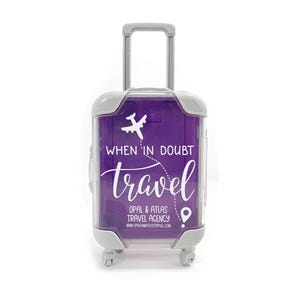 May include: A purple suitcase with a white airplane and the text "When in doubt, travel" and "Opal & Atlas Travel Agency" with a website address.
