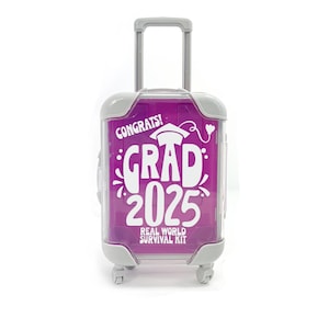 May include: A small, clear, grey suitcase with a purple background and the text "Congrats! Grad 2025 Real World Survival Kit" printed on it.