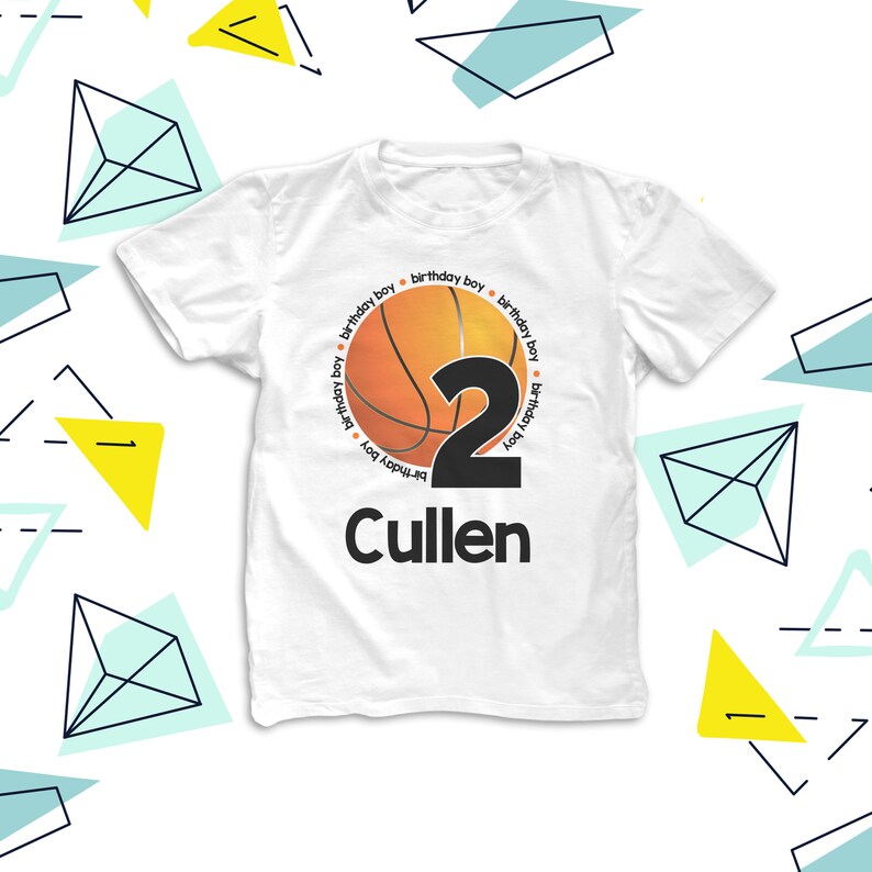 May include: White t-shirt with a basketball graphic and the number 2. The basketball is surrounded by the text "birthday boy" repeated around the circle. The name Cullen is printed below the basketball.