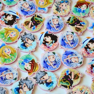 May include: A collection of colorful, round, illustrated keychains featuring various characters. The keychains are made of clear acrylic and have a pink border. The characters are depicted in a cartoon style and are wearing summery clothing.
