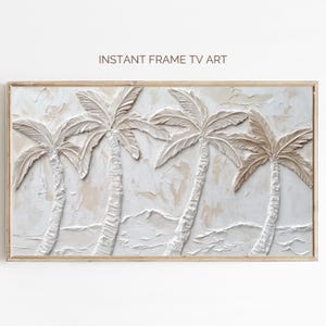 Puede incluir: Una impresión de arte de pared enmarcada que presenta una pintura texturizada en blanco y beige de tres palmeras sobre un fondo blanco. El texto "INSTANT FRAME TV ART" está impreso en la parte superior del marco.