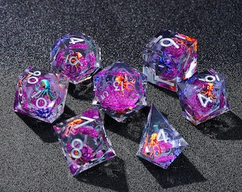 May include: A set of seven polyhedral dice with a fantasy theme. Each die is clear with a purple and pink glitter core, and features a miniature octopus. The numbers are white.