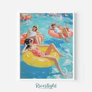 May include: A framed art print depicting a sunny pool scene. Three figures relax on inflatable rings in a turquoise pool. One figure is in a yellow ring, and the others are in orange rings. The artwork is signed and features the text "Riverlight Prints".