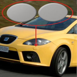 Puede incluir: Un coche amarillo con un parachoques delantero negro y una parrilla negra. El coche tiene una matrícula que dice "615 DZX". Hay dos objetos redondos grises sobre el parabrisas.