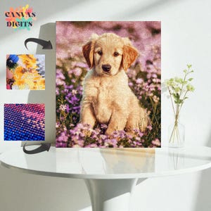 May include: A diamond painting kit showing a golden retriever puppy amidst purple flowers. The canvas art has the text "CANVAS DIGITS". The image is displayed on a white table. The kit includes tools and materials for creating the artwork.