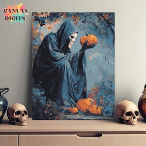 Puede incluir: Impresión en lienzo que representa una figura encapuchada con rostro de calavera sosteniendo una calabaza naranja. La figura está sentada en un entorno forestal con otras calabazas y follaje otoñal. El texto "CANVAS DIGITS" está en la esquina superior izquierda.