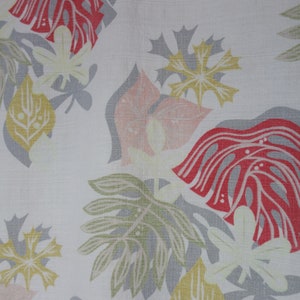 May include: A white fabric with a repeating pattern of stylised leaves and flowers in shades of pink, red, yellow, and grey.