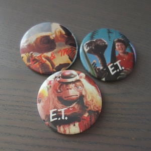 Set of 3 Vintage E.T. The Extra-Terrestrial 2&quot; Pins, E.T. in Wig, Gertie &quot;E.T. and Me,&quot; & Elliott with E.T., All Have General Wear From Age