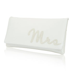 Ivory satin bridal clutch for wedding day.  The design on the front says MRS which is made from ivory glitter.