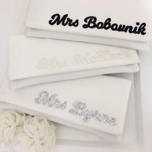 Ivory satin MRS bridal clutch for wedding day.  It can be personalised with the brides new surname, made from black, ivory or silver glitter.