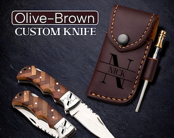 May include: An olive-brown custom knife with a wooden handle and a stainless steel blade. The knife is accompanied by a brown leather sheath with the name "NICK" engraved on it. A sharpening steel is also included.