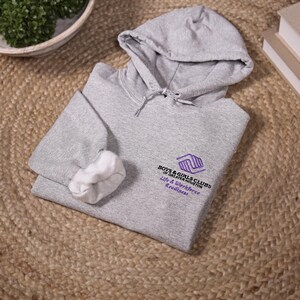May include: A gray hooded sweatshirt with a white inner lining. The sweatshirt has an embroidered logo that says "Boys & Girls Clubs of Greater Houston" and "Life & Workforce Readiness".