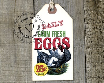May include: A rectangular paper tag with a string loop featuring a graphic of three roosters and the text DAILY FARM FRESH EGGS and 25c DOZEN. The tag has a cream background with red and green lettering and a yellow circle containing the price.