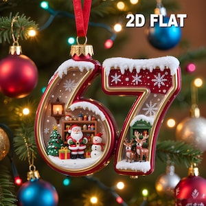 May include: A festive Christmas ornament shaped like the numbers "67", with a red and gold trim. The "6" features Santa Claus, a snowman, and a Christmas tree. The "7" has reindeer. The ornament is hanging from a red ribbon, with the text "2D FLAT" visible.