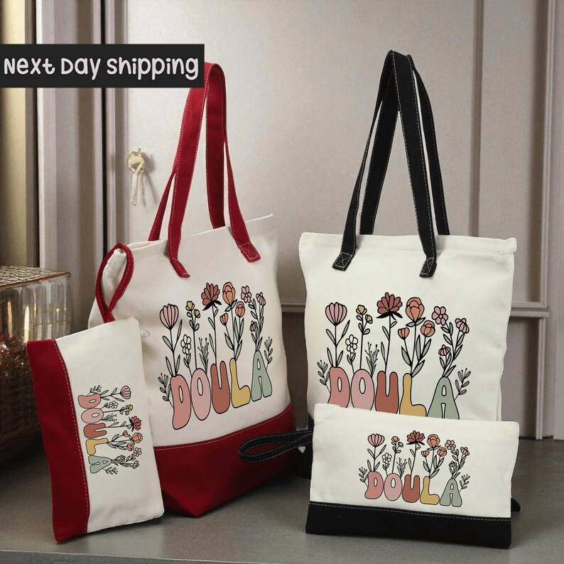 a collection of bags and accessories, including a red and white tote bag, a white tote bag, and a small black bag, all featuring the word "DOULA" printed on them.