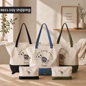 a collection of tote bags and small bags with the text "I MAKE YARN PURETY Emily" printed on them. The bags are arranged on a wooden surface, with a framed quote in the background.