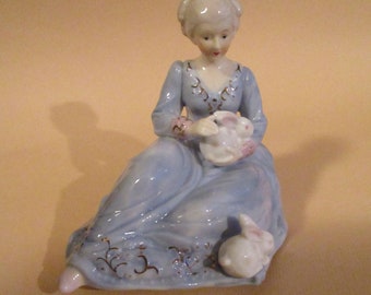 Vintage Musical Ceramic Revolving Figurine plays "Feelings" Girl with Rabbits