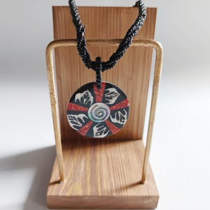Jumbo round swirl mother of pearl seashell necklace -conch shell and red coral pendant in black beaded cord