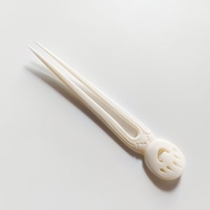 Bone hair stick 2 Prong , carved bear paw bone hair fork