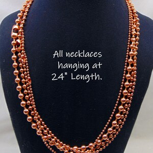 Juego de collar de 4 cadenas de bolas de cobre. Todas de 24" de largo. El tamaño de las bolas aumenta de 2,4 mm a 3,2 mm, a 4,5 mm y a 6,3 mm. Producto de EE. UU. 99,97 % puro. Sin níquel. imagen 5