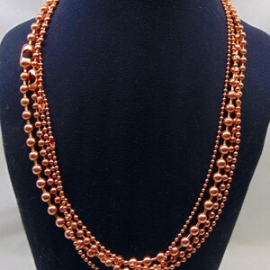 Juego de collar de 4 cadenas de bolas de cobre. Todas de 24" de largo. El tamaño de las bolas aumenta de 2,4 mm a 3,2 mm, a 4,5 mm y a 6,3 mm. Producto de EE. UU. 99,97 % puro. Sin níquel. imagen 6