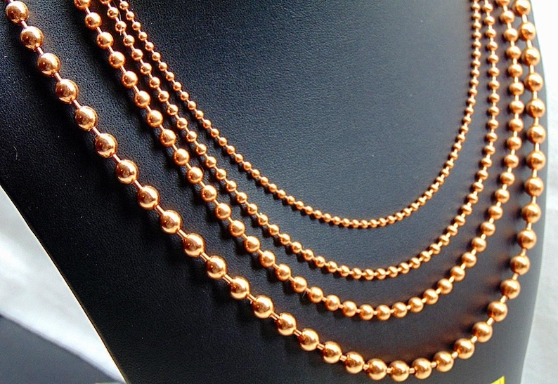 Juego de collar de 4 cadenas de bolas de cobre. Todas de 24" de largo. El tamaño de las bolas aumenta de 2,4 mm a 3,2 mm, a 4,5 mm y a 6,3 mm. Producto de EE. UU. 99,97 % puro. Sin níquel. imagen 3