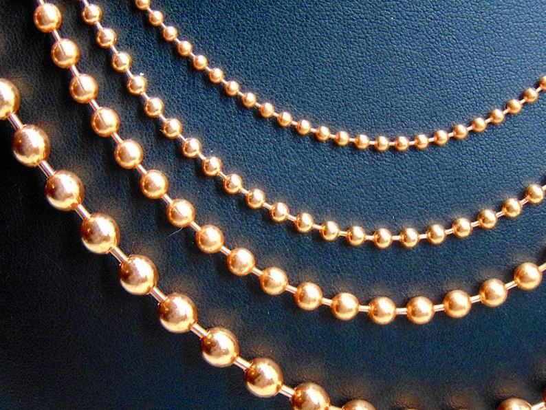 Juego de collar de 4 cadenas de bolas de cobre. Todas de 24" de largo. El tamaño de las bolas aumenta de 2,4 mm a 3,2 mm, a 4,5 mm y a 6,3 mm. Producto de EE. UU. 99,97 % puro. Sin níquel. imagen 2