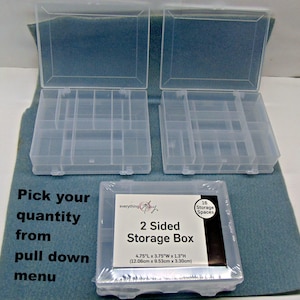 May include: Clear plastic 2-sided storage boxes with multiple compartments. The boxes are open, revealing the interior dividers. One box is packaged with a label that reads "2 Sided Storage Box" and dimensions of 4.75"L x 3.75"W x 1.3"H.